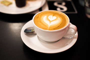 Cappuccino on dark table
