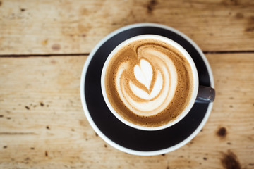 Cappuccino on wooden table 