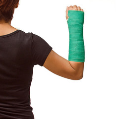 Closeup of a broken arm in a cast isolated on white background