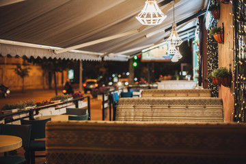 Cozy outdoor cafe at night
