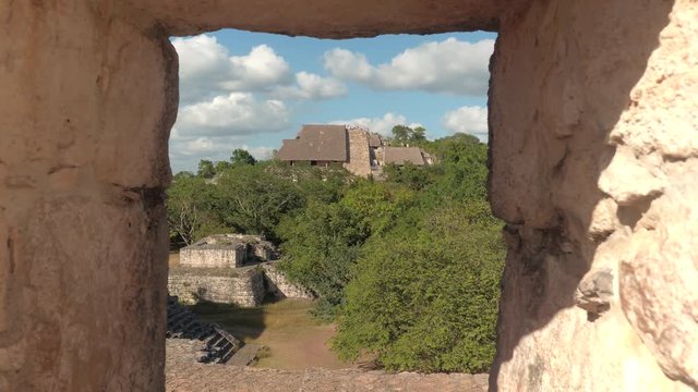 Revealing impressive Maya stone-built city at Ek Balam archeological site. Tourists visiting majestic ruins of the temple and acropolis in Tulum, Mexico. Remains of an ancient Mayan village in jungle