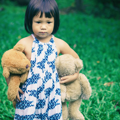 Cute little girl with a bear