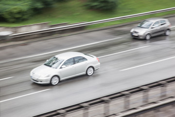 Obraz na płótnie Canvas Autobahn cars high speed traffic at rush hour in Berlin