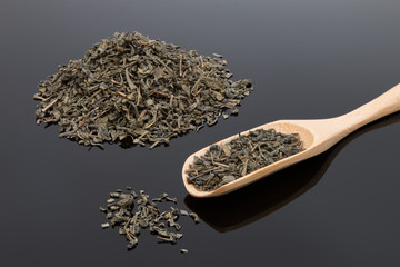 Fototapeta premium Green tea on a mirror surface...