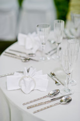 restaurant glass of water on table / dish and spoon