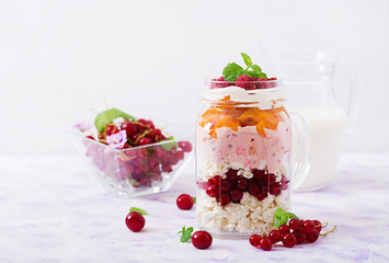 Cottage cheese and yoghurt desserts with summer berries in a jar