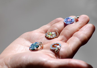 Holding earrings in palm of hand