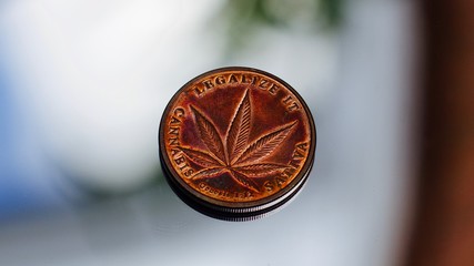 Fototapeta na wymiar Brass cannabis coin