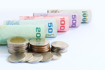 closeup banknote roll and coins thailnad sort