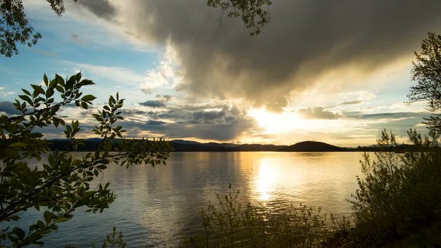 Time lapse of colorful sunset moving on slider at lake Coeur d'Alene