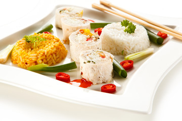 Roast, stuffed chicken  roulade with rice and vegetables on white background 