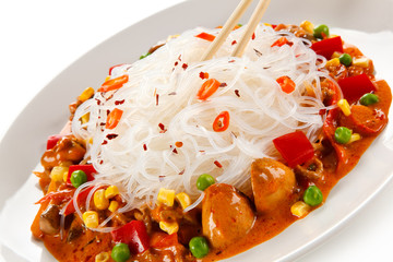 Rice noodles with meat, sauce and vegetables 