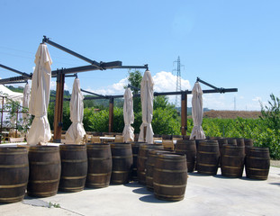Wine barrels on patio outside in Italy