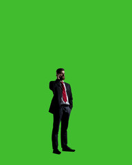 Businessman with smartphone standing over chroma key background. Business, career job concept.