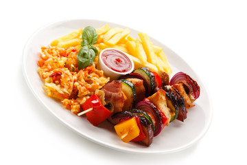 Kebabs - grilled meat and vegetables on white background 