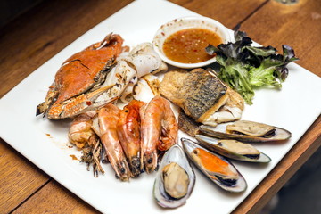 Grilled seafood dishes in a dish with Thai spicy sauce.