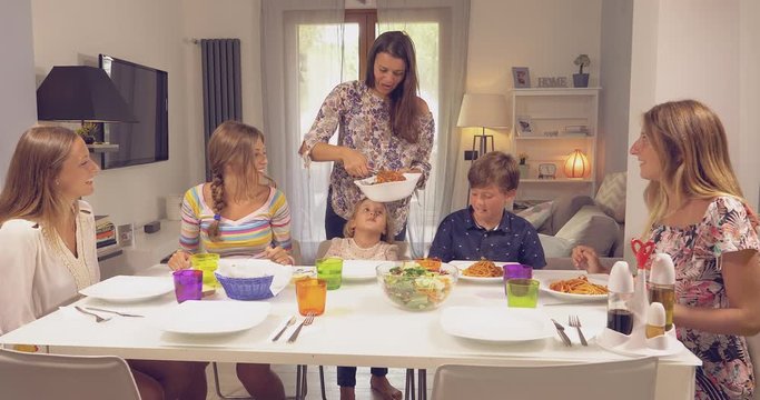 Happy family ready to eat italian spaghetti
