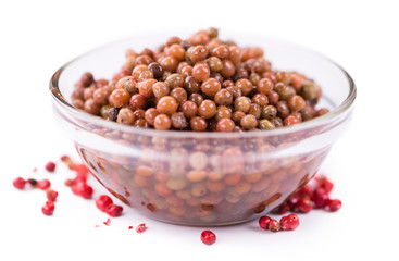 Portion of preserved Pink Peppercorns isolated on white