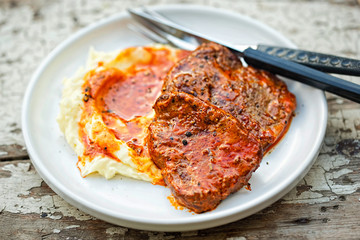 Beef steak in tomato sauce with tomato puree 