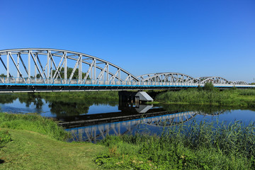 Fototapeta premium Bridge across the Narew river in Tykocin, Poland
