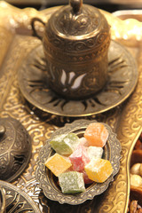 Traditional Turkish coffee with silver metal cup and Turkish delight