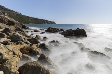 Fototapeta na wymiar Rancho Palos Verdes rocky coast view with motion blur waves in Los Angeles County, California. 