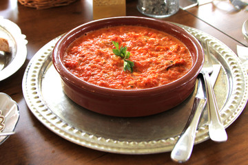 Traditional Turkish cuisine, Menemen in a earthenware bowl. ( omelette with tomato,green pepper, onion )
