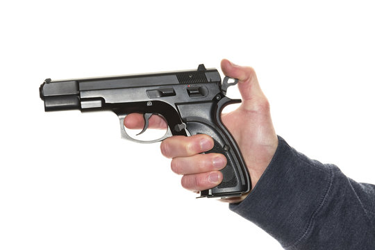 Man's hand holding gun isolated on white background
