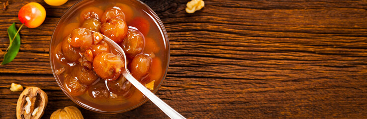 Cherry Jam with Nuts. Azerbaijani Cuisine White Cherry Preserves. Selective focus.