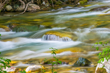 Kolasinskaya River flows through the city with a rapid flow. Montenegro, Kolasin.