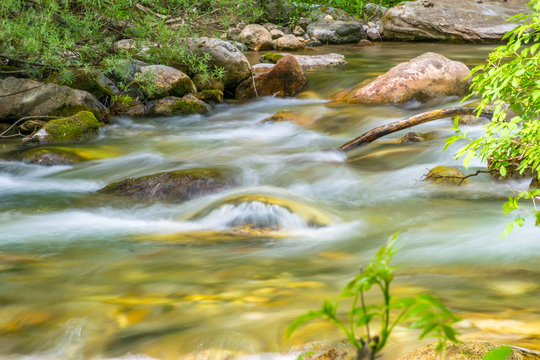 Kolasinskaya River flows through the city with a rapid flow. Montenegro, Kolasin.