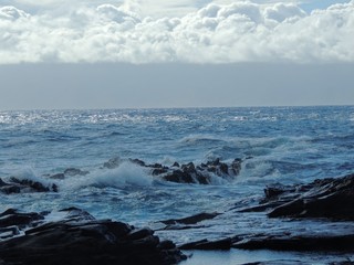 Coastline and rugged lava rocks called Dragon’s Teeth and crashing waves at Makaluapuna Point near Kapalua, Maui, HI, USA
