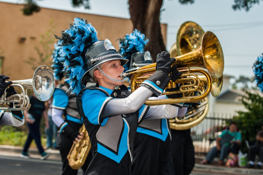 Marching band female baritone player in the number one position.