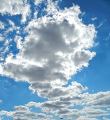 Obraz premium Cloud Shaped Like A Tornado In The Cloudy Blue Sky