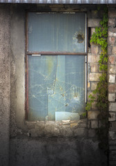 Broken window of an abandoned building