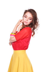 Beautiful woman with curly hair wearing a red jacket, isolated on white background