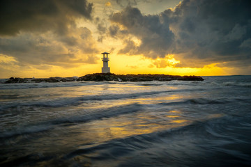 Fototapeta premium Lighthouse on the sea under sky.