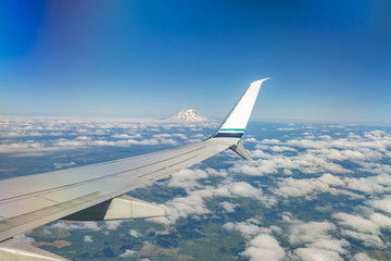 Flying by Mount Rainier in Washington State park views from a commercial plane