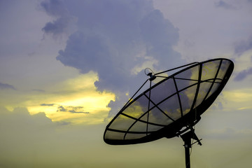 Satellite dishes communication technology network with sky sunset