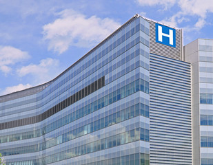 Building with large H sign for hospital - 166846543