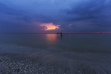 A small wooden dock used by fisherman to tie their boat.