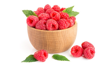 Raspberry in a wooden bowl isolated on a white background