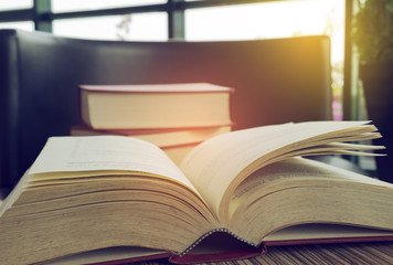 Old books on the table in library.