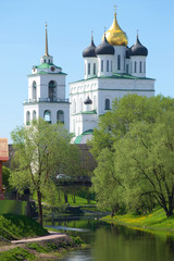 Fototapeta na wymiar Trinity Cathedral close-up in the May landscape. Pskov, Russia