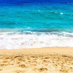 Empty Beach and ocean as  background with copy space. Sandy beach, blue sky and sea. Summer relax concept.