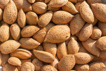 Group of raw almonds, background. Main ingredient for nougat Sicilian