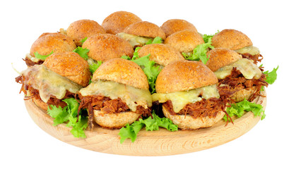 Group of small shredded beef sandwich sliders with melted cheese isolated on a white background