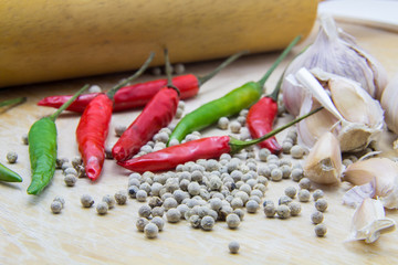 spices and herbs on the wooden table, for cooking.