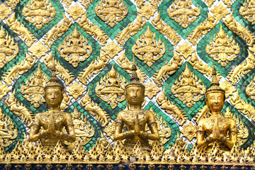 Detail of carvings on temple wall at Wat Phra Kaew, the Temple of Emerald Buddha in Bangkok, Thailand