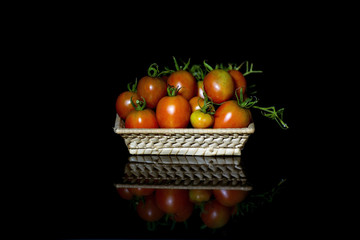  Group of tomatoes in a wicker basket